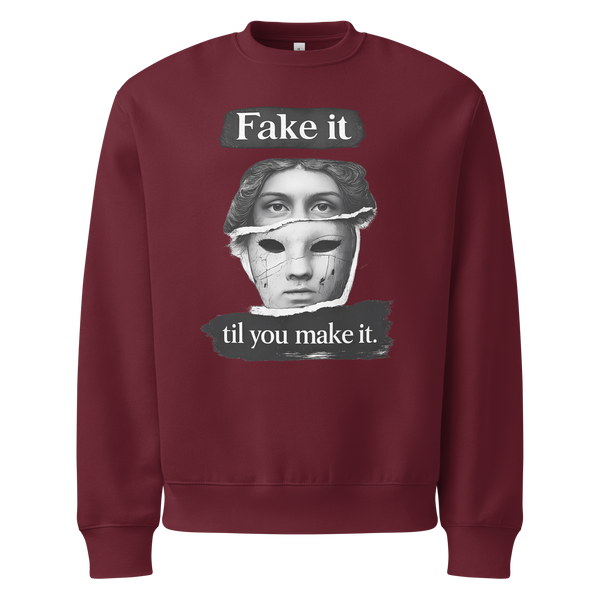 Burgundy unisex sweatshirt front view with illustrated face graphic and motivational text print, modern streetwear sweatshirt