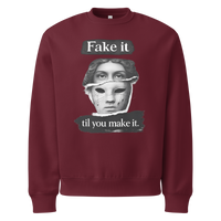 Burgundy unisex sweatshirt front view with illustrated face graphic and motivational text print, modern streetwear sweatshirt