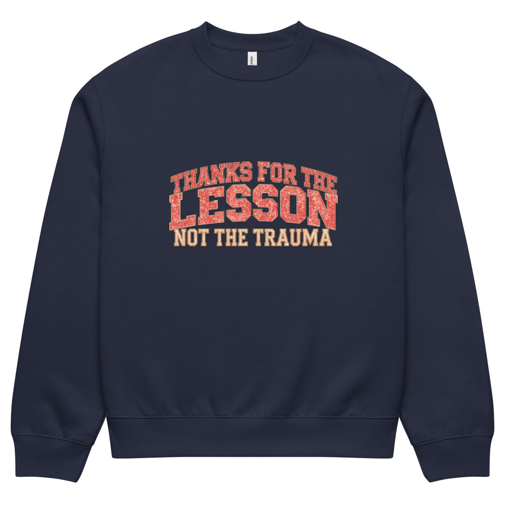 Navy blue unisex sweatshirt front view with “Thanks for the Lesson, Not the Trauma” motivational typography print, modern streetwear pullover