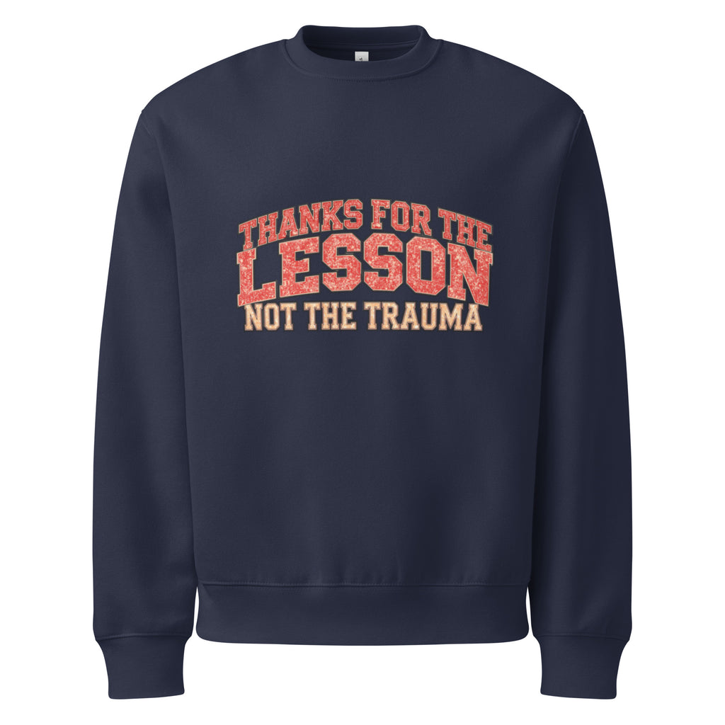 Navy blue unisex sweatshirt front view with “Thanks for the Lesson, Not the Trauma” motivational typography print, modern streetwear pullover