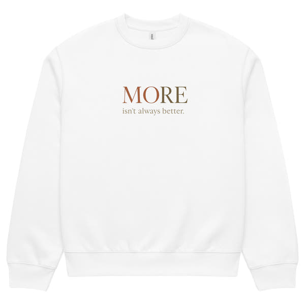 White oversized heavyweight sweatshirt with “MORE Isn’t Always Better” slogan, statement streetwear piece