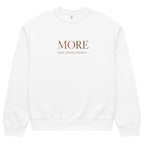 White oversized heavyweight sweatshirt with “MORE Isn’t Always Better” slogan, statement streetwear piece