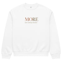 White oversized heavyweight sweatshirt with “MORE Isn’t Always Better” slogan, statement streetwear piece