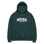 Dark green Nöiré ESTB 2025 oversized hoodie, front product view, graphic streetwear