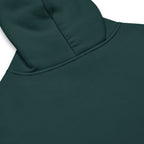 Dark green Nöiré hoodie, close-up hood and fabric detail, graphic streetwear