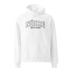 White Nöiré ESTB 2025 logo hoodie, front hanging view, urban streetwear outfit