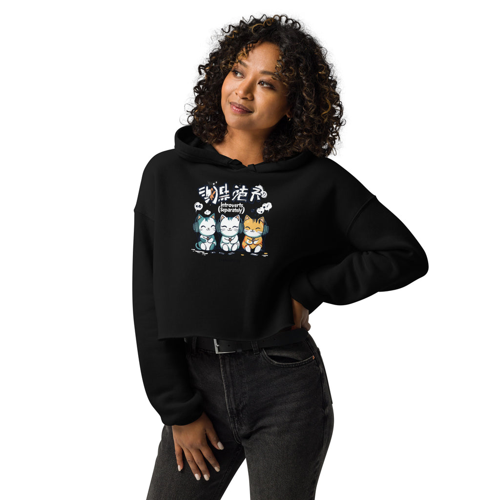 Woman wearing black cropped streetwear hoodie with cute introvert cats cartoon graphic and introverts separately text, casual lifestyle outfit