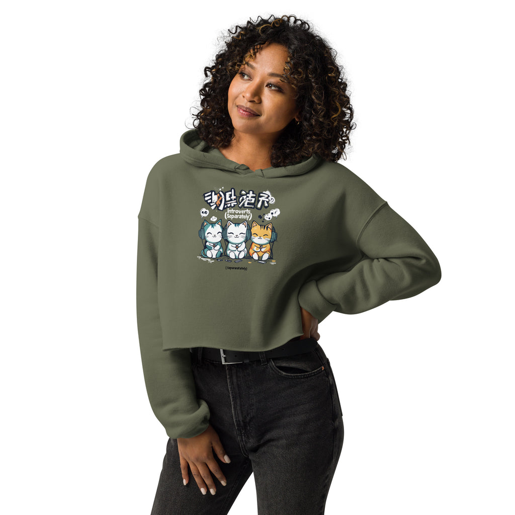 Woman wearing military green cropped streetwear hoodie with cute introvert cats cartoon graphic and introverts separately text, casual lifestyle outfit